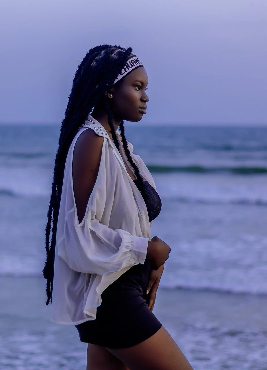 Woman with braids by the sea