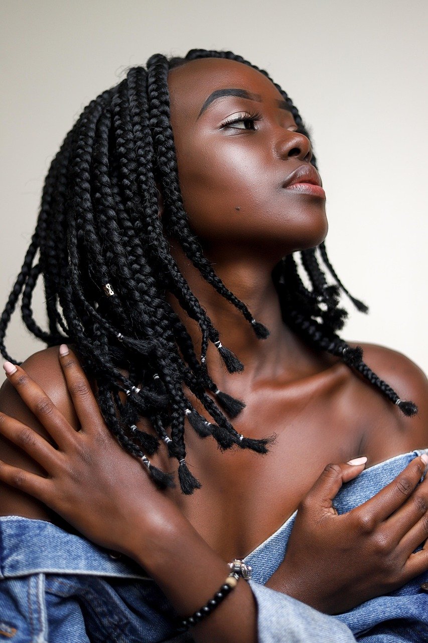 Portrait of woman with black braids