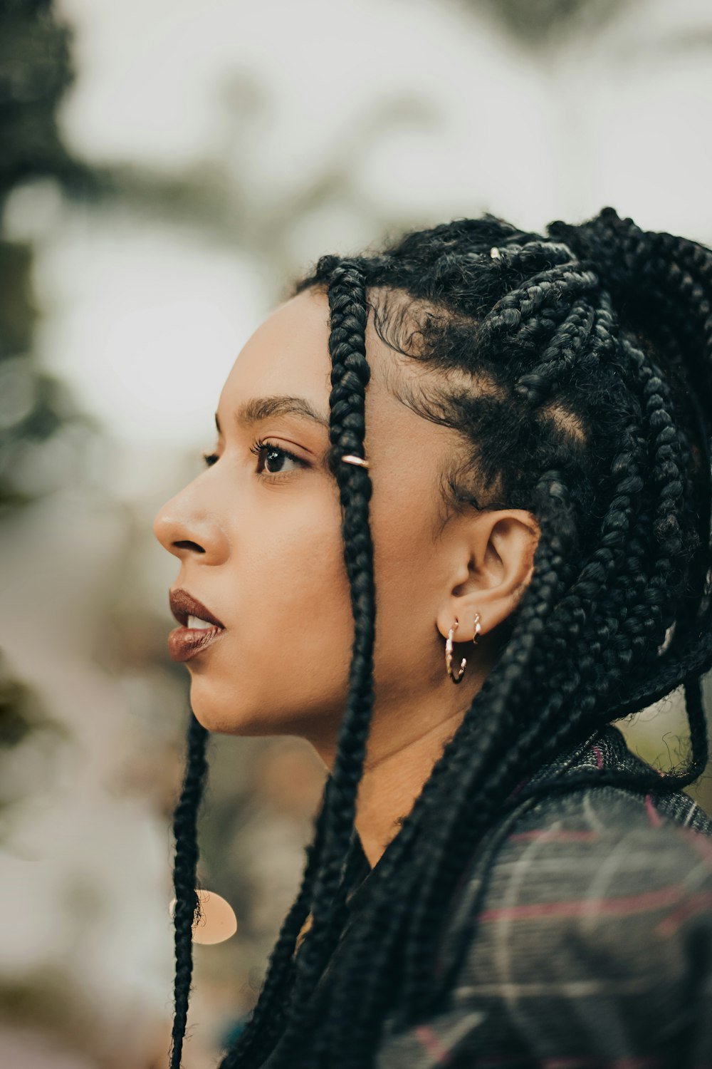 Woman with long braids in profile