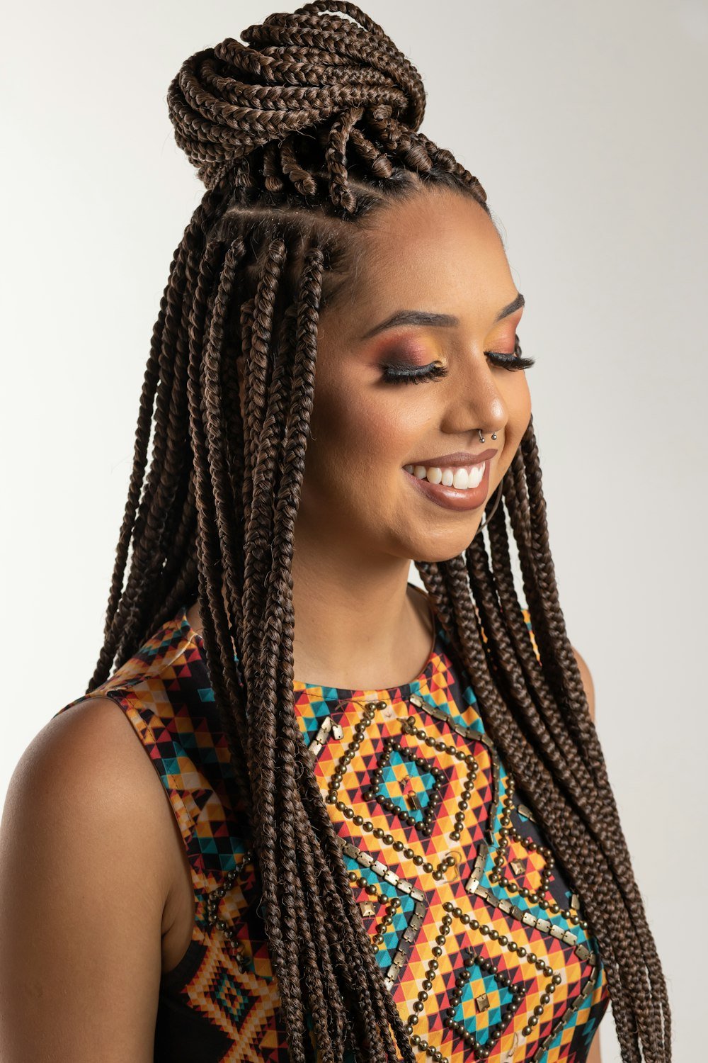 Smiling woman with long brown braids